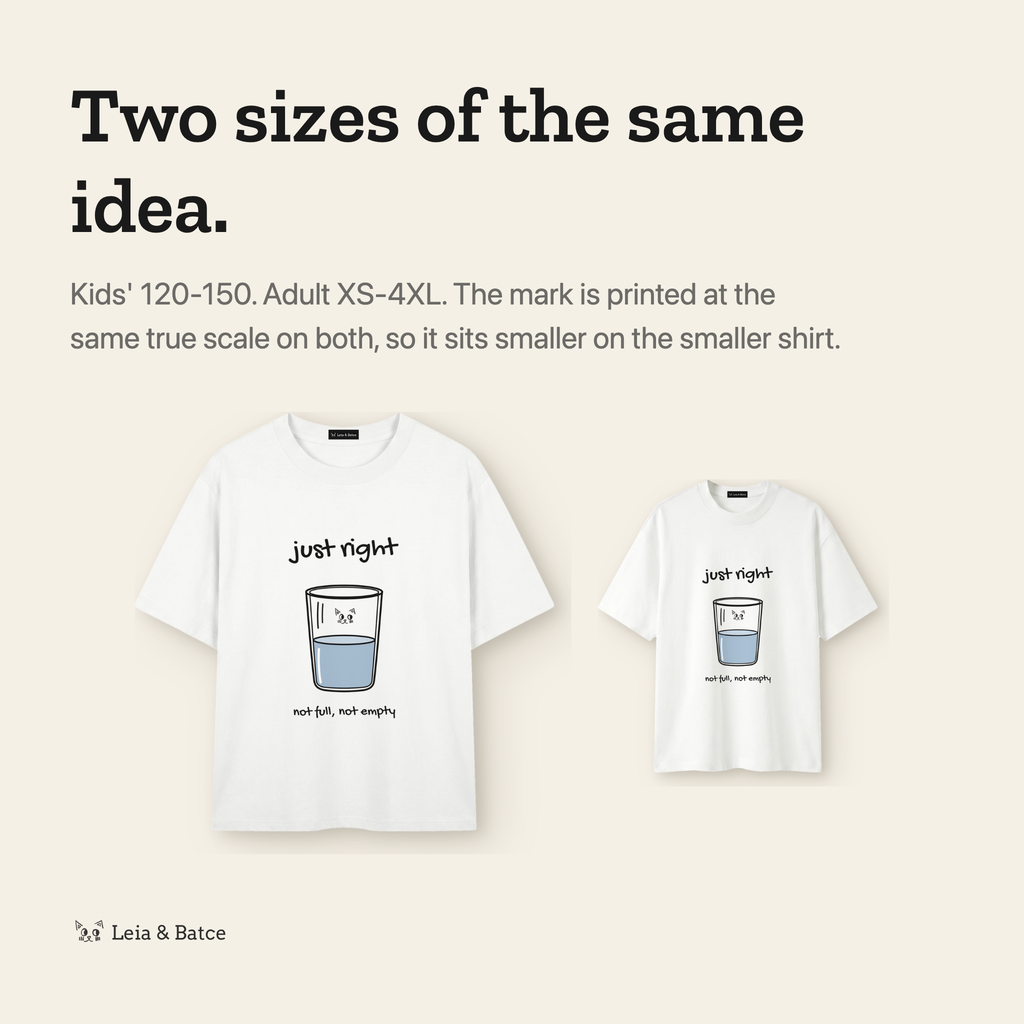 The same mark printed at true scale on the kids' and adult shirts