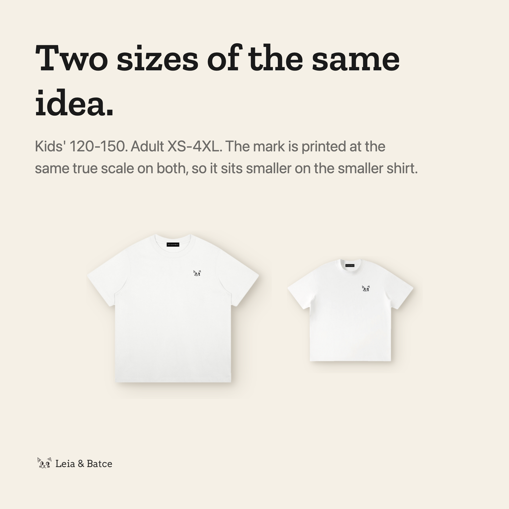The same mark printed at true scale on the kids' and adult shirts
