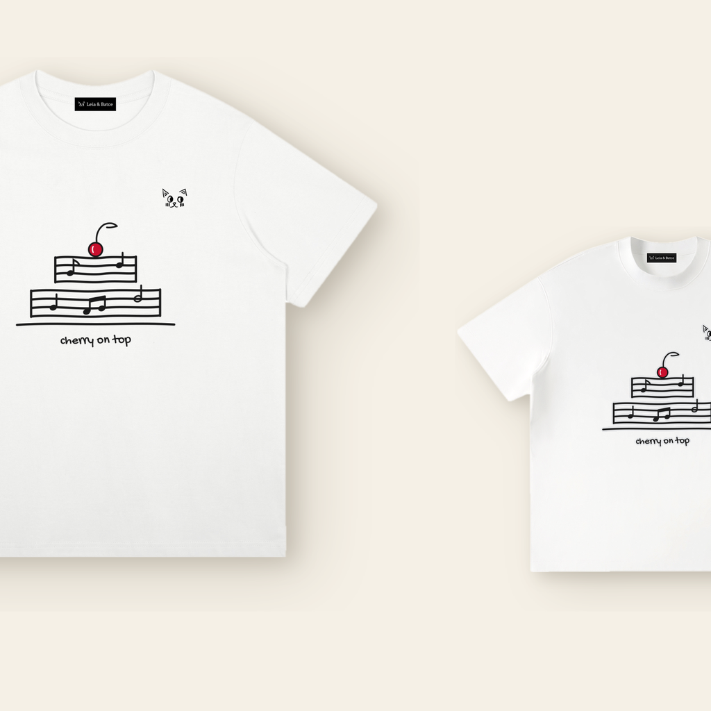 The Cherry on Top T-Shirt in adult and kids sizes side by side, the same mark drawn to scale for each