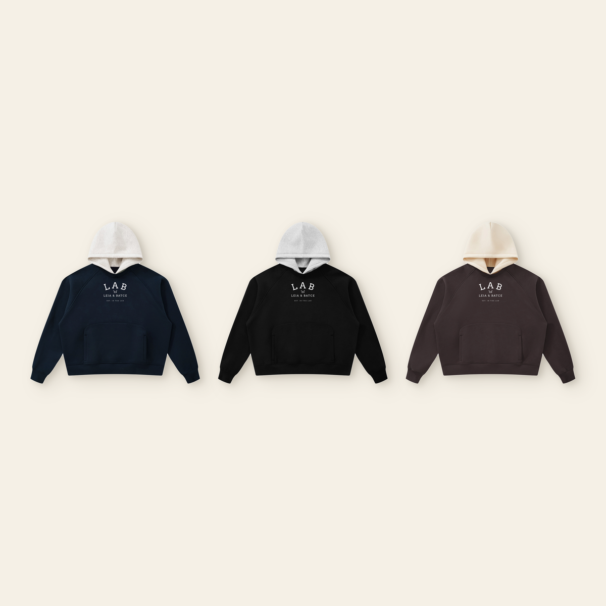 The Batce Lab Raglan Hoodie – Adult in all 3 colors: Navy / Oatmeal, Black / Heather Gray, Brown / Peach
