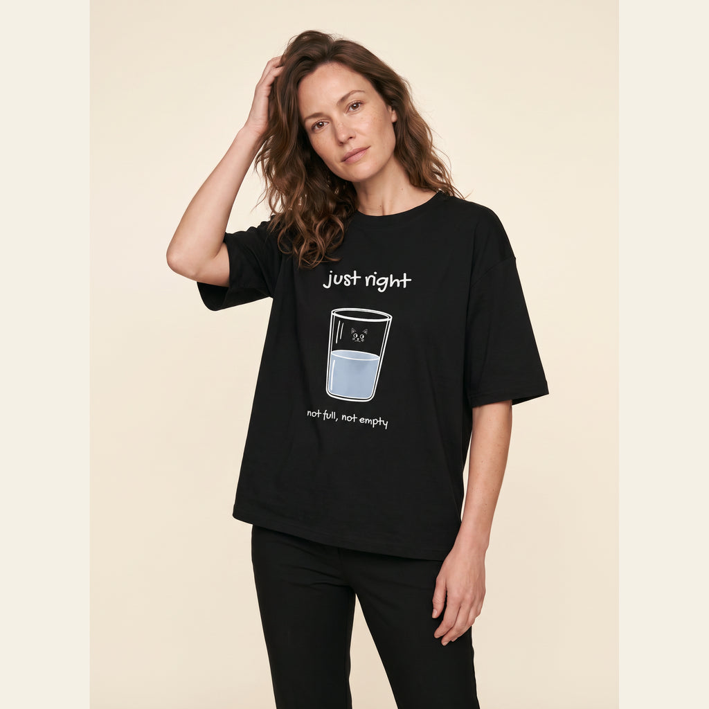 The Just Right T-Shirt – Adult in Black, worn by an adult, with the small Just Right mark on the chest