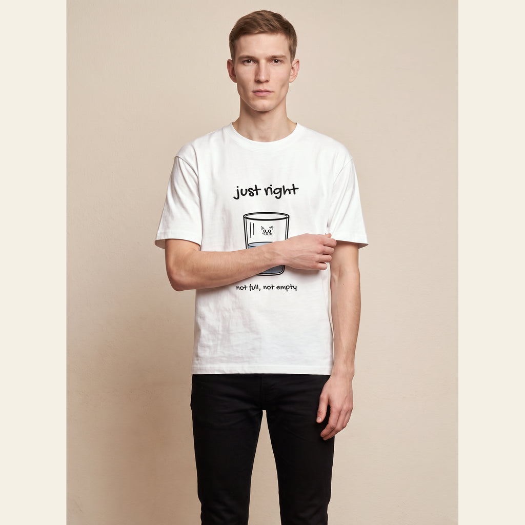 The Just Right T-Shirt – Adult in White, worn by an adult, with the small Just Right mark on the chest