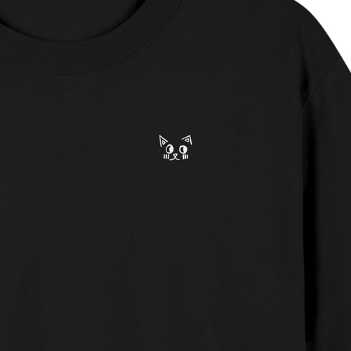Close-up of the Batce mark printed in white ink on the black tee.