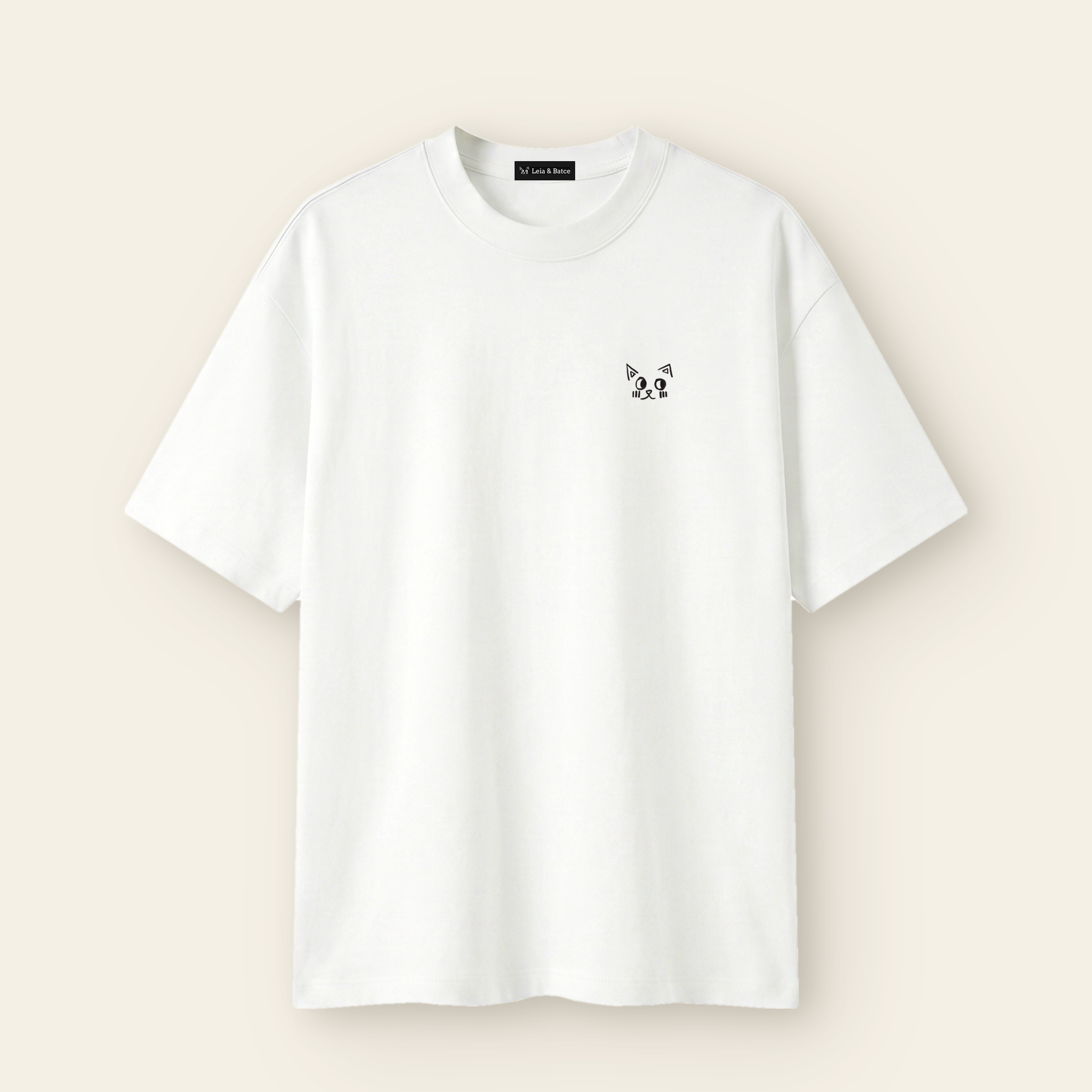 The Batce T-Shirt - Kids in White with the hand-drawn Batce mark and woven brand label.