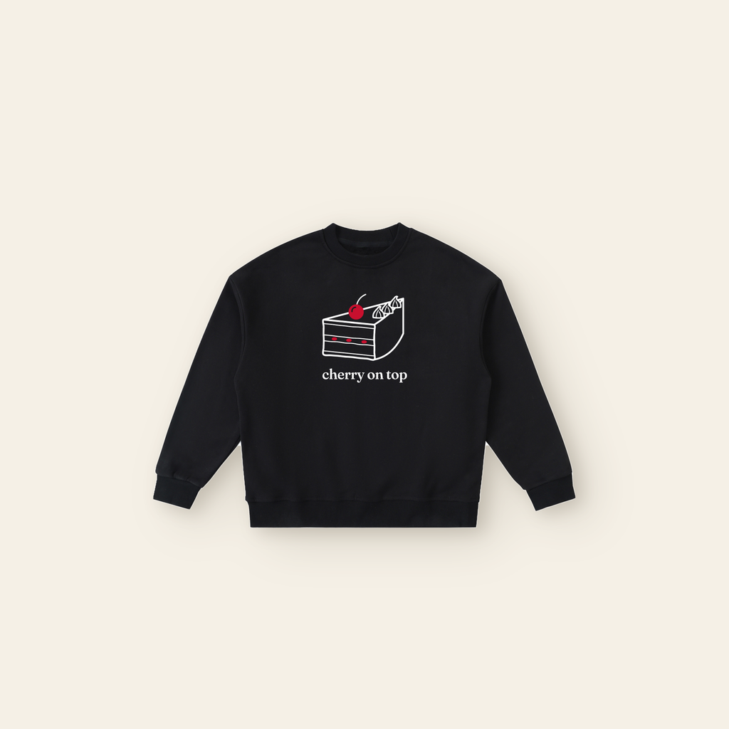 Cherry on Top Cake Fleece Sweatshirt – Kids in Black, laid flat