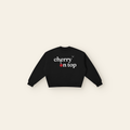 Cherry on Top Lettering Boxy Fleece Sweatshirt – Adult in Black, laid flat