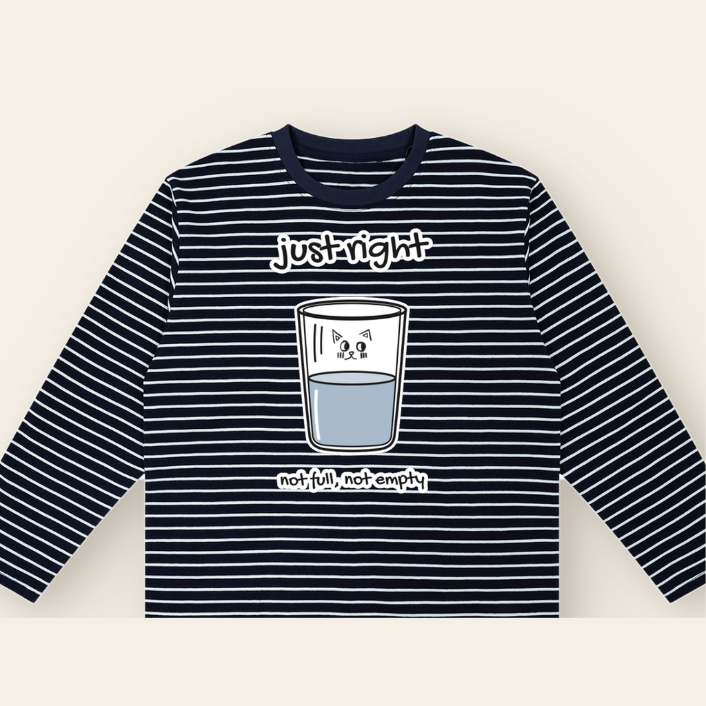 Close-up of the Just Right mark printed on the Navy / White long-sleeve t-shirt