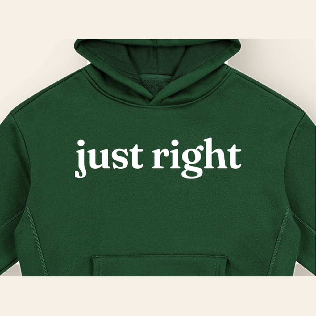 Close-up of the Just Right mark printed on the Dark Green hoodie