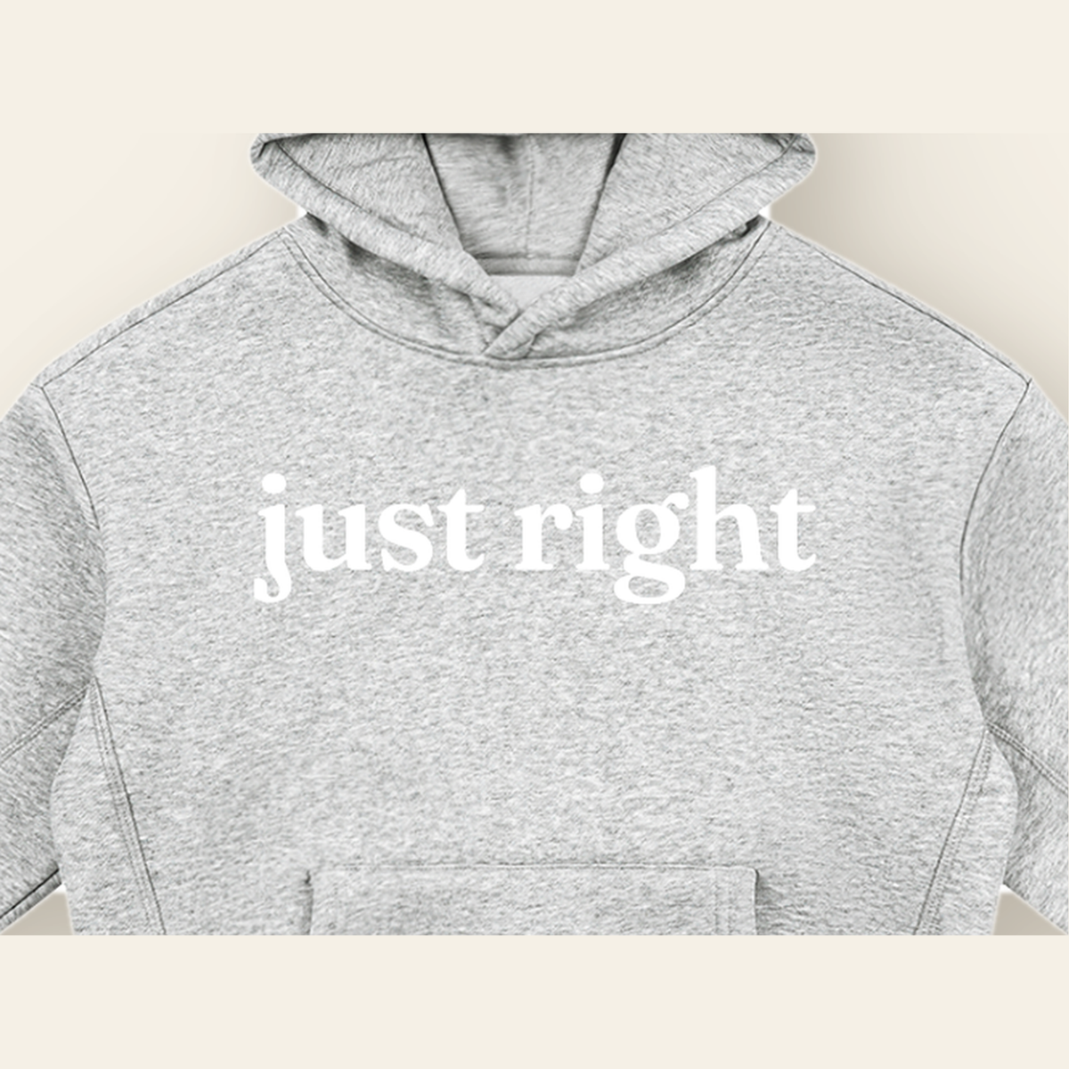 Close-up of the Just Right mark printed on the Heather Gray hoodie