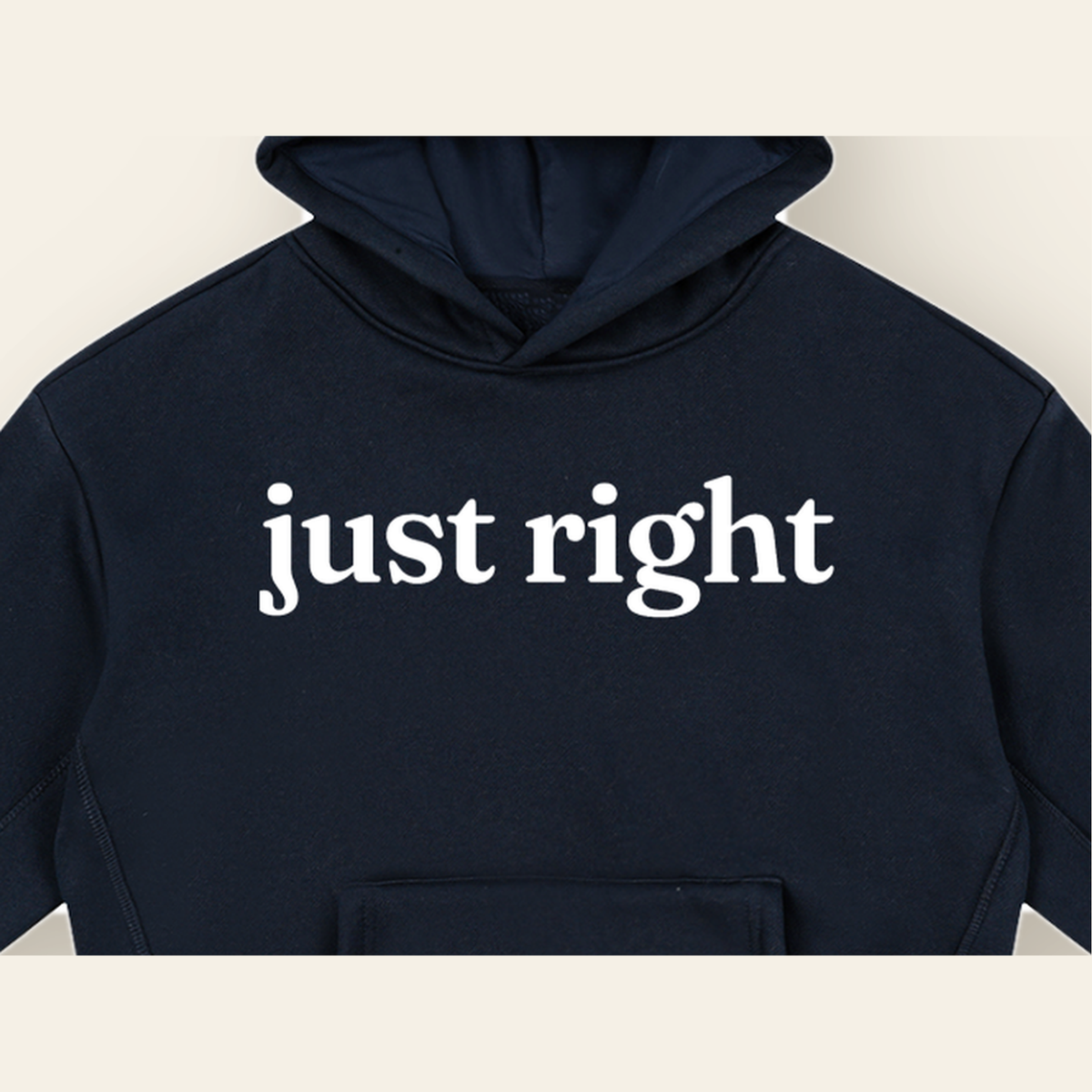 Close-up of the Just Right mark printed on the Navy Blue hoodie