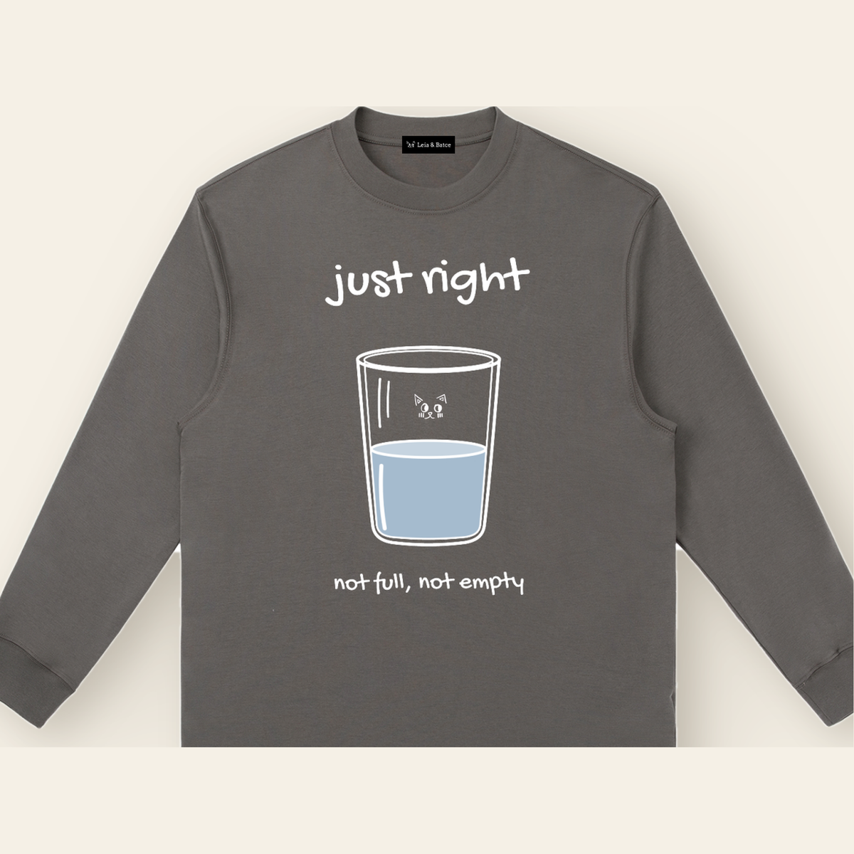 Close-up of the Just Right mark printed on the Dark Gray long-sleeve t-shirt