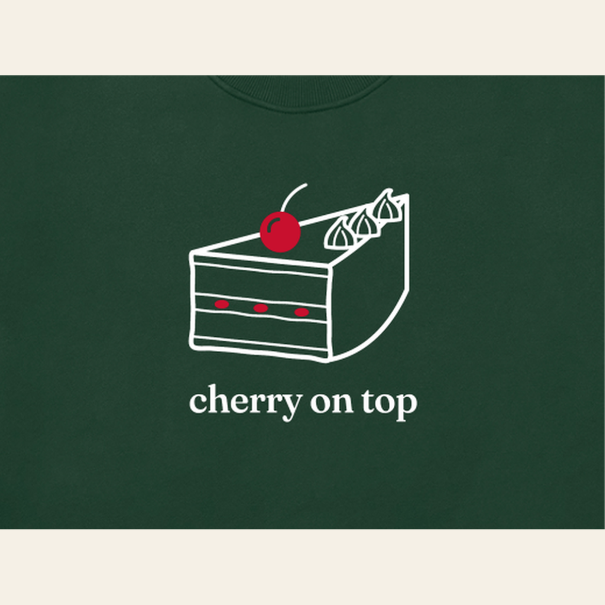 Close-up of the Cherry on Top mark printed on the Dark Green sweatshirt