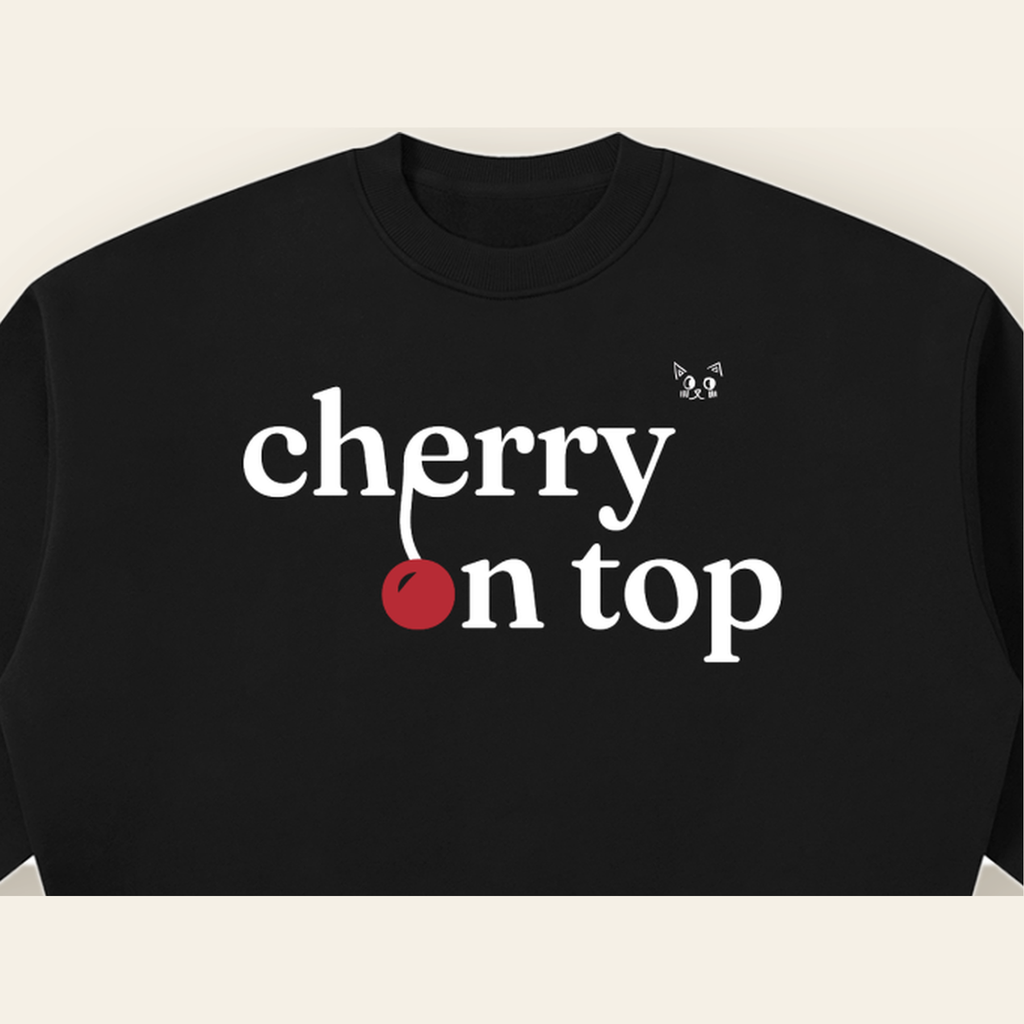 Close-up of the Cherry on Top mark printed on the Black sweatshirt