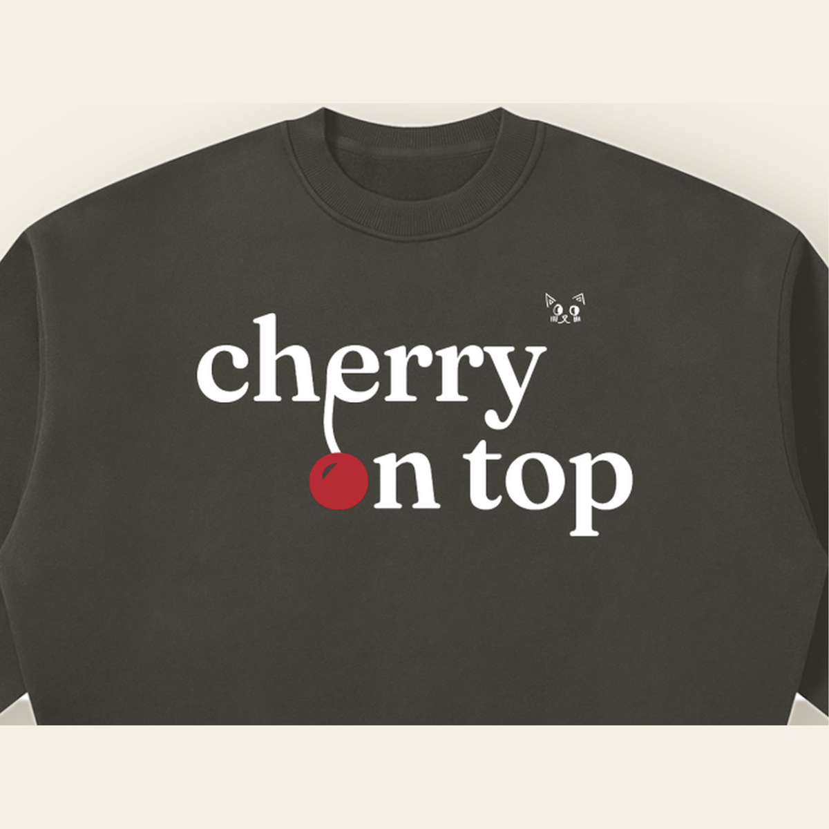 Close-up of the Cherry on Top mark printed on the Dark Gray sweatshirt
