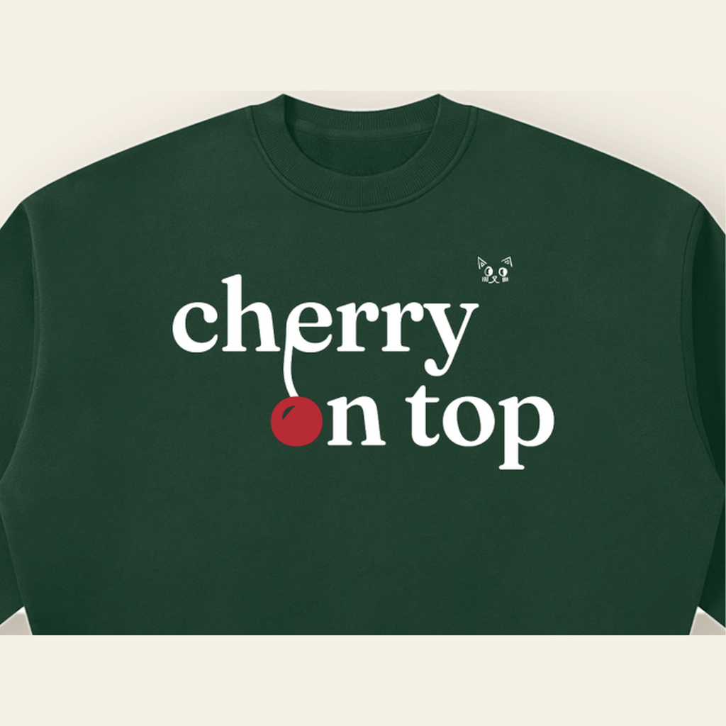 Close-up of the Cherry on Top mark printed on the Dark Green sweatshirt