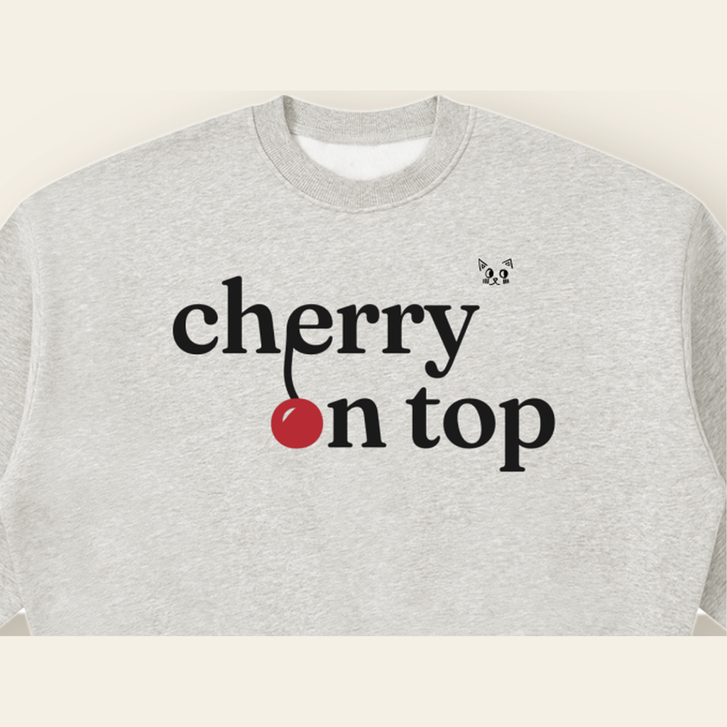 Close-up of the Cherry on Top mark printed on the Heather Gray sweatshirt