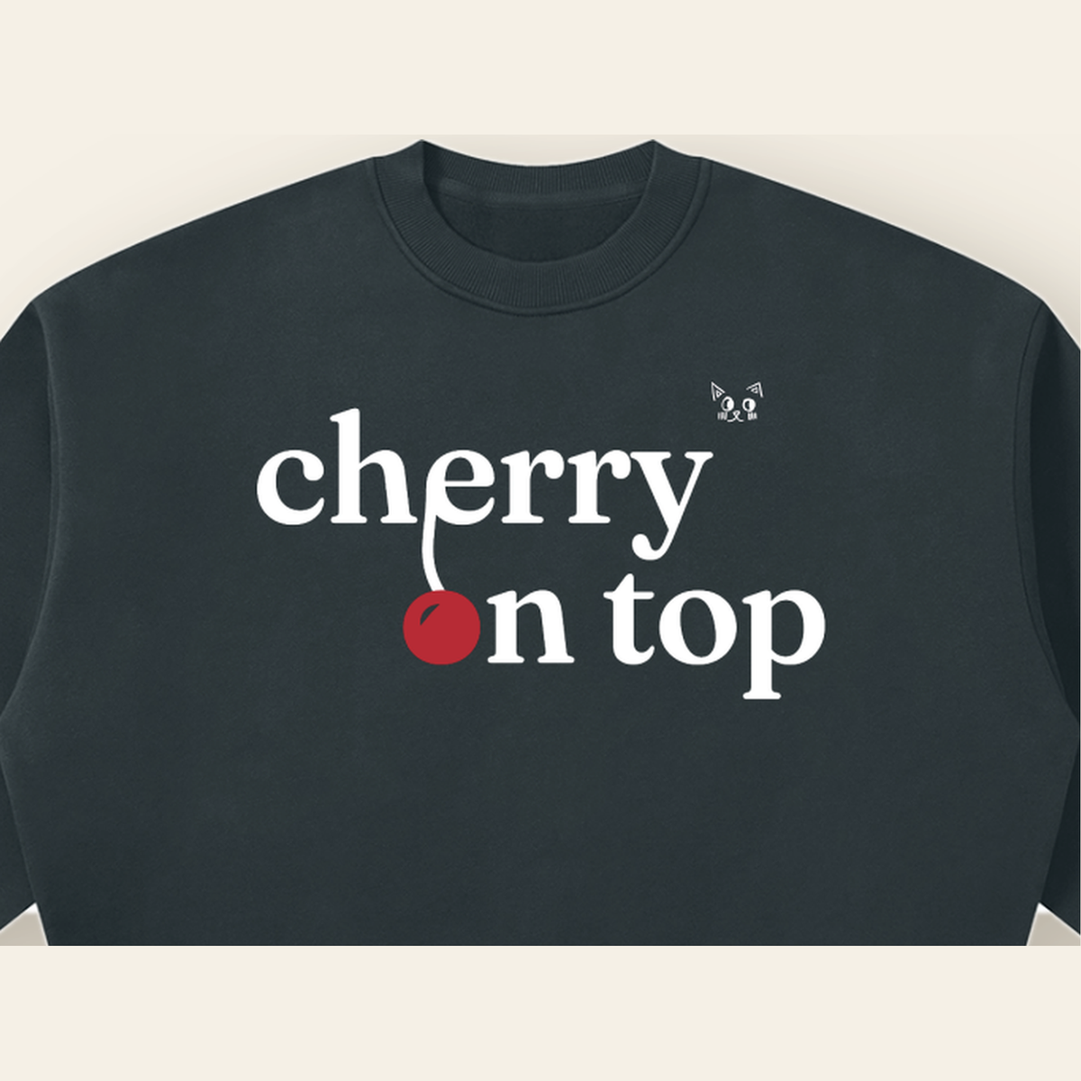 Close-up of the Cherry on Top mark printed on the Navy Blue sweatshirt