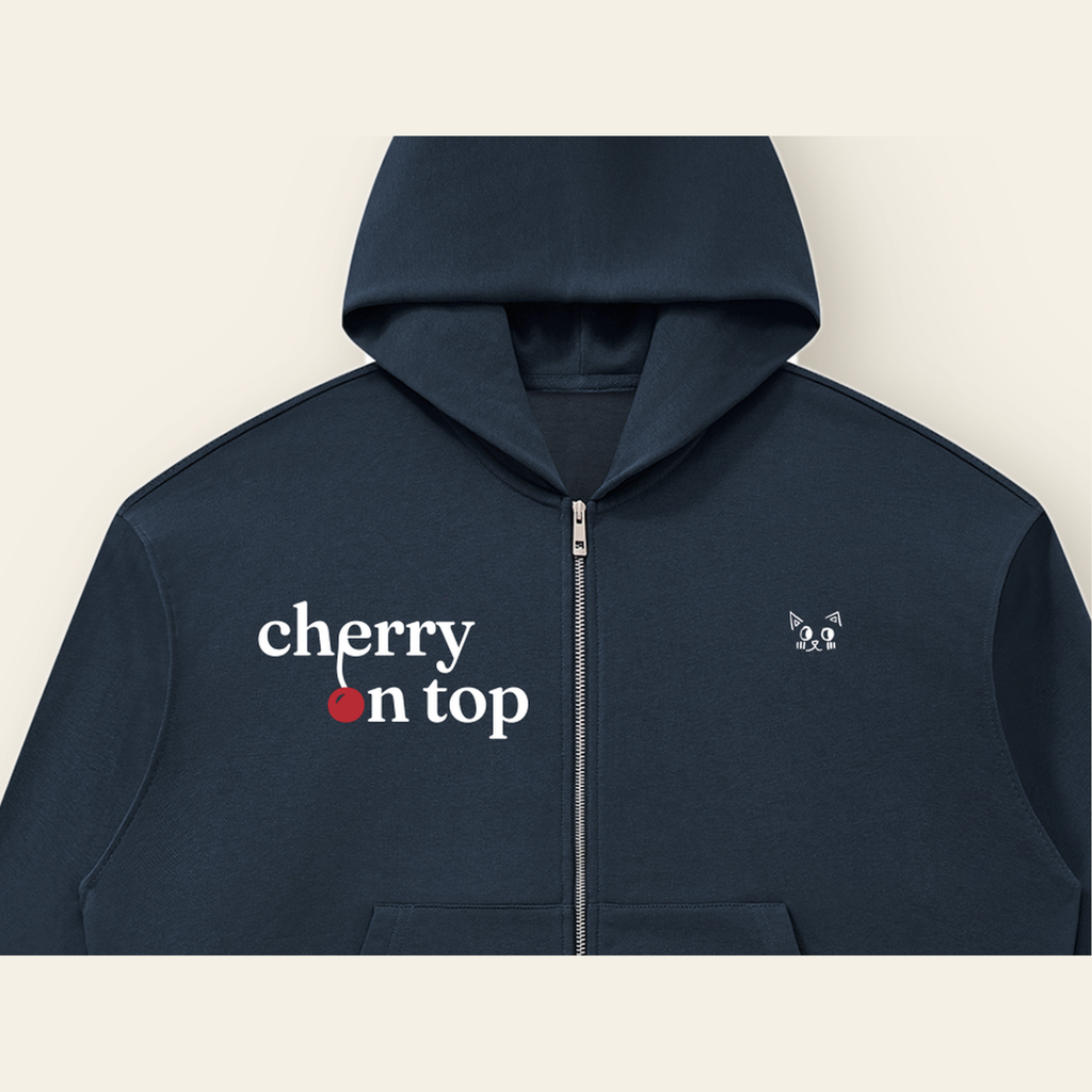 Close-up of the Cherry on Top mark printed on the Navy Blue zip hoodie
